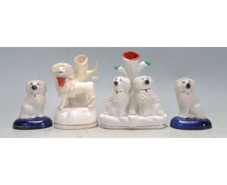 A group of four 19th century / 20th century Staffordshire flat back ceramic porcelain cabinet figurines in a form of a Poodle