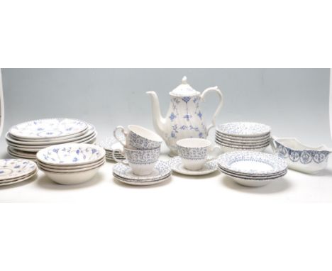 A collection of vintage retro 20th century blue and white dinned service ware to include Myott Finlandia teapot, soup bowls a