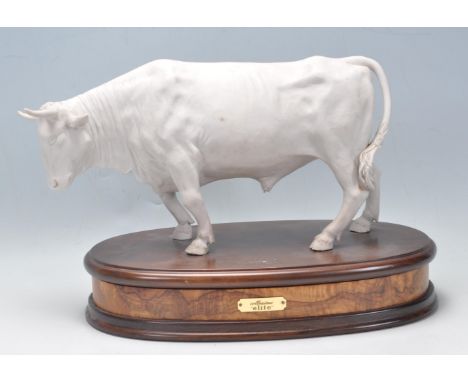 A 20th century circa 1970's Italian blanc de chine ceramic bull. The bull posing in stand up position with the head slightly 