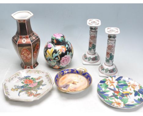 A group of 20th century Chinese / Japanese oriental ceramic porcelain ware to include a pair of ceramic candlesticks decorate