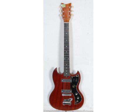A vintage 1970s Kay K-2T Les Paul style electric guitar having chrome tunings pegs to the headstock, ebonised fingerboard wit