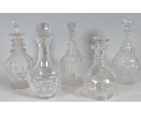 A collection of five 18th century and 19th century George III glass decanters of various sizes and shapes. The collection inc