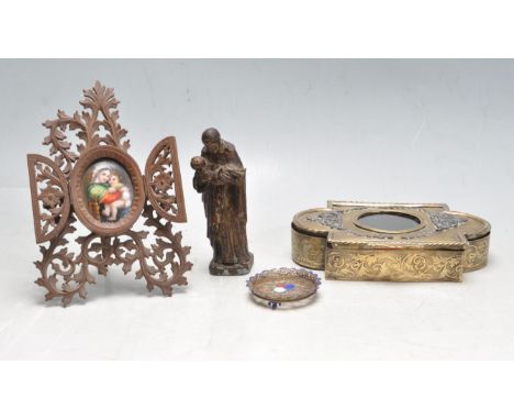 An Edwardian early 20th century ornate brass jewellery box together with a cast metal biblical figure, a ceramic panel depict