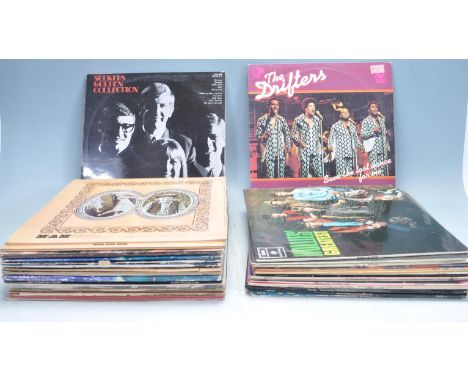 A collection of 40+ vintage vinyl LP long play records fromthe 1970s &amp; 1980s. To include Status Quo Pro BX 1,&nbsp; The K