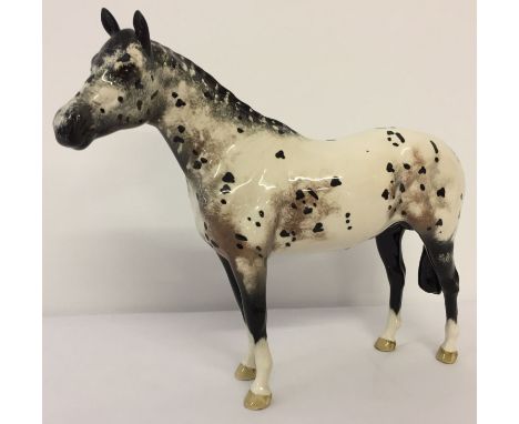 A Beswick ceramic Appaloosa Stallion, model #1772B, in colourway No. 2. Designed by Arthur Gredington, with circular backstam