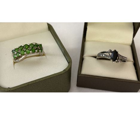 2 modern design stone set silver dress rings.A twist design set with 14 round cut green diopside stones by The Genuine Gem Co