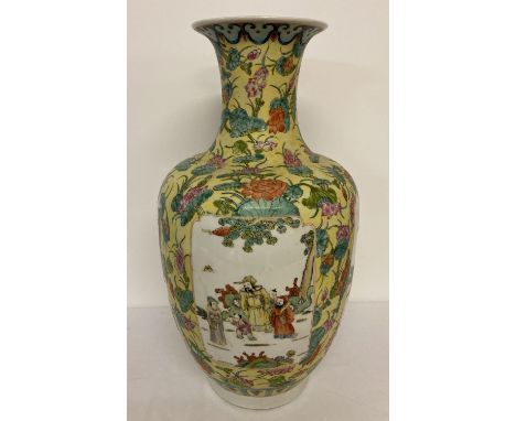 A very large Chinese ceramic vase in yellow ground glaze with lotus flower design. With figural panel detail, signed to under