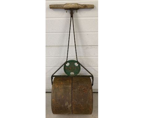 A vintage cast iron "Ironcrete" garden roller by Scoffin &amp; Willmott Ltd, London. With wooden handles and original paintwo