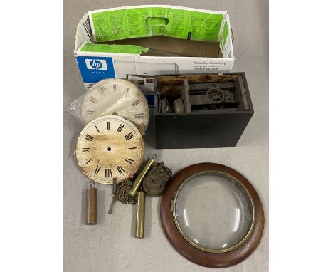 A box of vintage clock parts, to include clock faces, chains and weights.