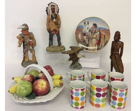 A box of assorted ceramics and ornaments. To include: a set of 6 matching mugs, a figurine of a Sioux Chief by D. Montfort, a