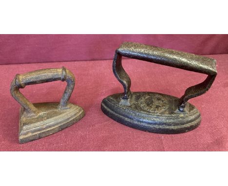 2 small vintage collar flat irons. Largest approx. 9cm tall x 12 cm long.