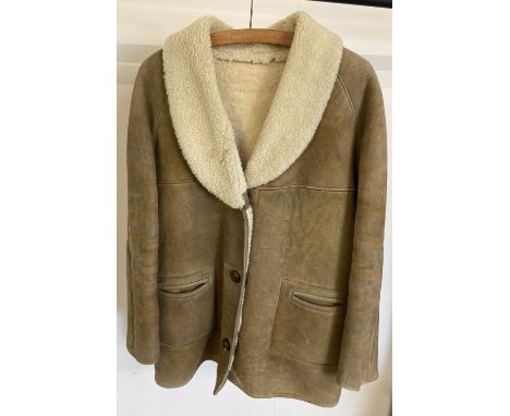 A vintage ladies sheepskin jacket. Fleece lining and collar, button front with two front pockets. Chest approx 42 inches.