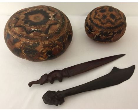 A small collection of vintage carved ethnographic items. Comprising: 2 South American carved gourd lidded pots, an African ca