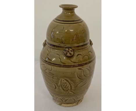 A slim necked brown/yellow glaze ceramic vase with fish and lotus flower detail. Approx. 18cm tall.