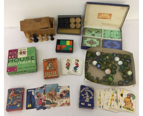 A collection of vintage and antique games and toys. To include: Vintage French Chess Set; Vintage Draught Set; Jacques Snap C