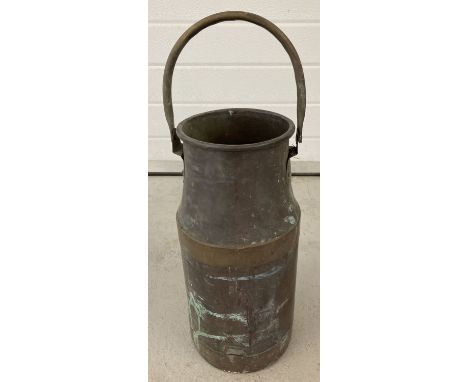 A vintage copper milk churn with brass banding and carry handle. Approx. 50cm tall including handle.