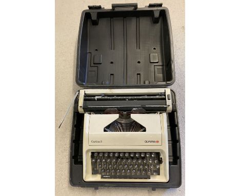 A vintage "Carina 2" typewriter by Olympia. Complete with carry case.