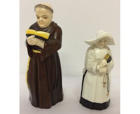 2 Royal Worcester ceramic candle snuffers in the form of a monk and a Nun. Largest approx. 12cm tall.