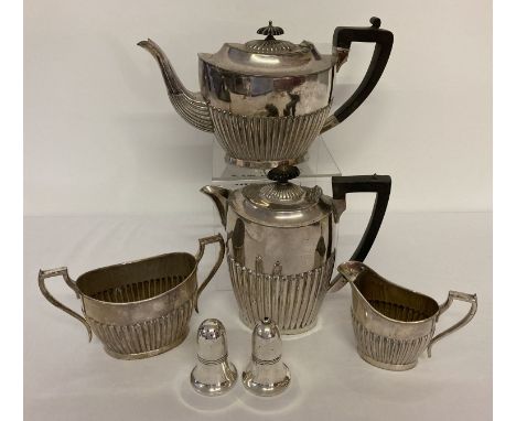 A vintage silver plated 4 piece tea set together with a heavy Sheffield plate cruet.