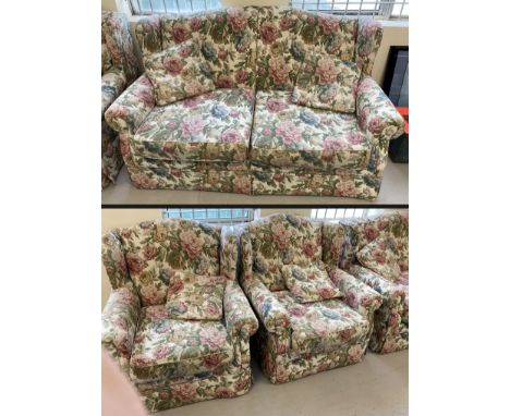 A metal framed 2 seater sofa and matching arm chairs in a floral design upholstery. With 4 matching small cushions.