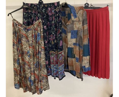 3 vintage 1980's skirts, one with matching scarf. Together with a blouse and skirt set. Designs by Adini and Andrew gee Sizes