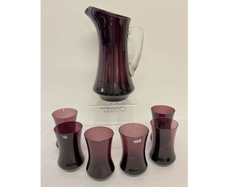 A vintage Polish aubergine coloured glass water jug and 6 matching tumblers.