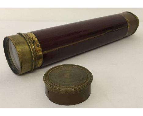 A vintage brass 3 draw telescope with wooden casing, complete with lens cap. Wooden casing is split.