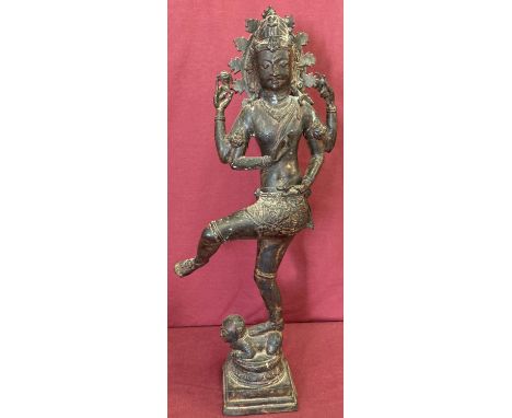 A large vintage hollow spelter figurine of the Hindu god Shiva standing atop the demon of ignorance. Approx. 62cm tall.
