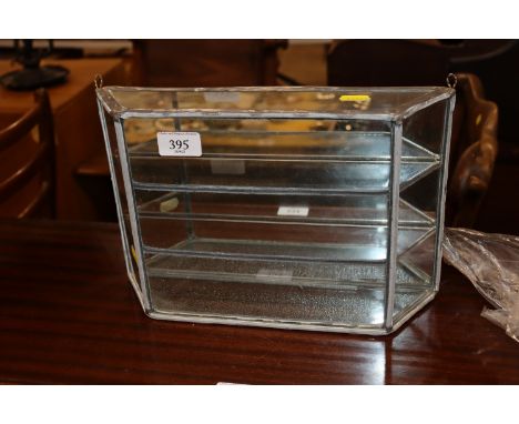 A small mirror back display cabinet