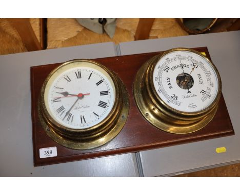 A brass cased clock and a brass cased barometer