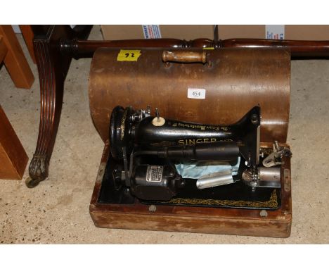 A vintage Singer electric sewing machine, sold as collectors item