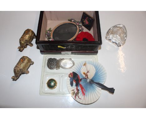 A wooden and fabric box and contents including picture frame, compact, paper weight, decanter label etc. 