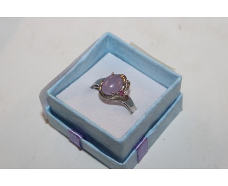 A Sterling silver and lavender jade and ruby coloured stone ring, ring size R/S