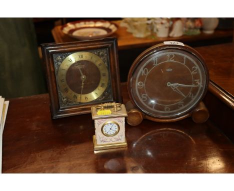 A Smiths mantel clock; a Metamec mantel clock and one other