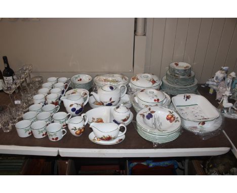 An eight person setting of Royal Worcester "Evesham Vale" dinner and teaware 
