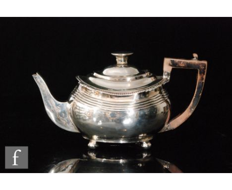 A George III hallmarked silver boat shaped tea pot with part reeded decoration, weight 14.5oz, London 1819, S/D. 