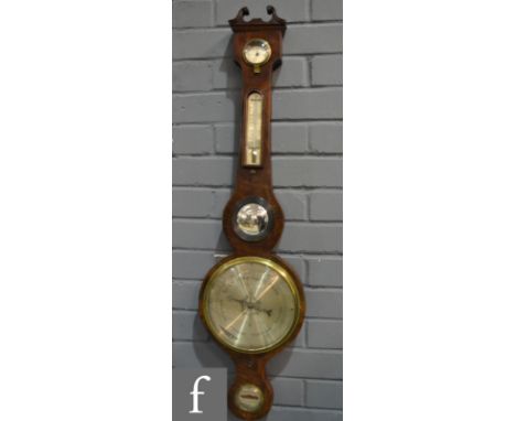 A late 19th Century mahogany wheel barometer with silvered register, dry/damp and thermometer, P. Roncoroni, Basingstoke, len