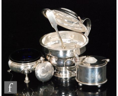 A Georgian hallmarked silver stepped circular pedestal mustard, with a smaller example, an open salt and a sovereign case, va