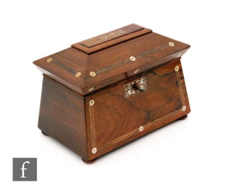 A 19th Century rosewood tea caddy of sarcophagus form with compressed bun feet, two divisions to interior, decorated with inl