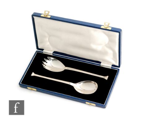 A cased pair of hallmarked silver salad servers with stylised Greek key detail to handles, Sheffield 1964. 