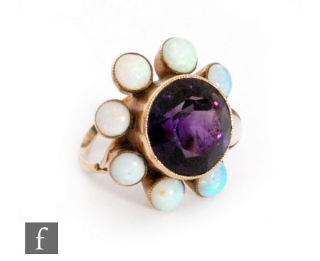 A 9ct amethyst and opal cluster ring, central collar set circular amethyst surrounded with eight individually collar set opal