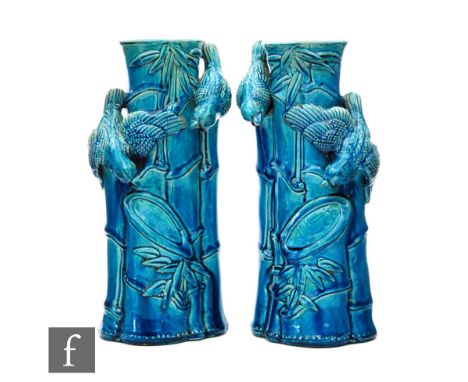 A pair of late 19th to early 20th British vases in the manner of Burmantofts, each formed as bamboo with handles formed as bi