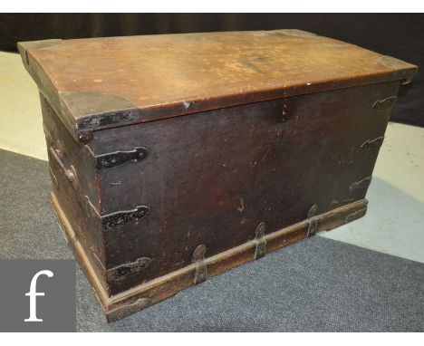 A late 19th to early 20th Century metal bound storage trunk or chest, with twin handles to the sides, width 98cm. 