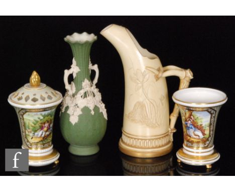 A Royal Worcester shape 1116 ice jug with handle formed as a tree root and tusks with sgraffito floral decoration, together w