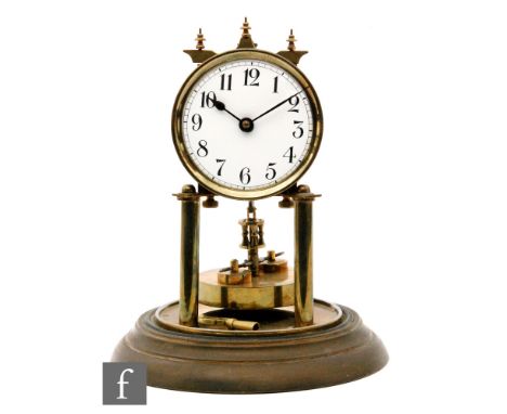 An early 20th Century 365 day mantle clock with Arabic dial, in glass dome, height 31cm. 