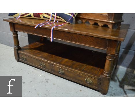 A 17th Century style light oak rectangular coffee table on turned legs above a drawer fitted base, height 52cm x depth 60cm x