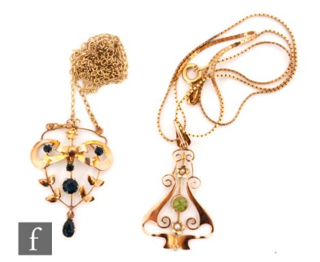 An Edwardian 9ct sapphire open work pendant suspended from a 9ct chain, with a similar peridot and seed pearl example, latter