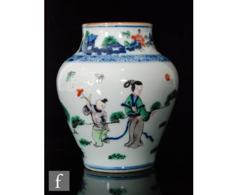 A Chinese porcelain wucai glazed 'Boys at play' vase, of meiping form, rising to a brown glazed rim, unmarked, height 18cm. 