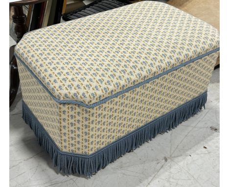 AN UPHOLSTERED OTTOMAN TRUNK WITH FRINGE95cm x 57cm x 45cm