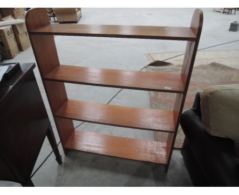 An early 20th Century mahogany open book shelf